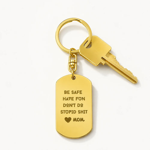 18k yellow gold engraved dog tag keychain for children be safe showcase on table