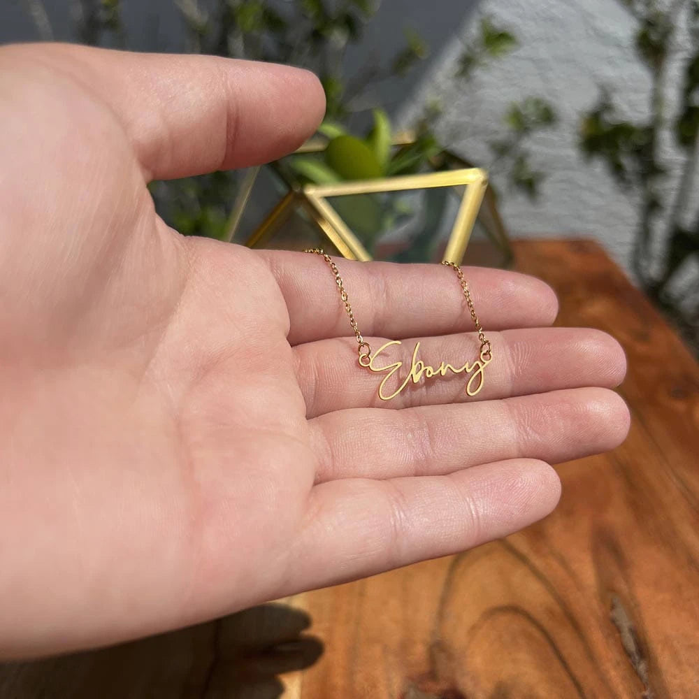 18k yellow gold personalized signature name necklace for her showcase in hand