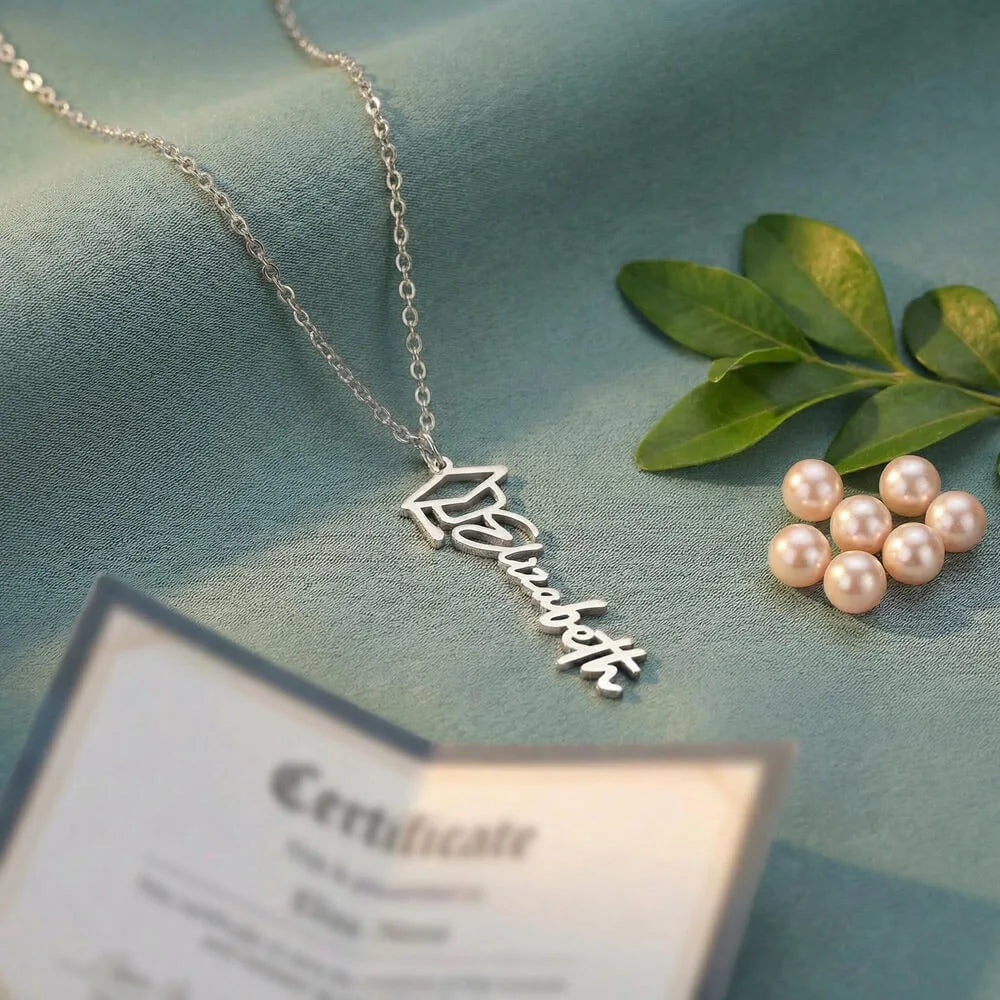 polished stainless steel personalized graduation cap necklace showcase on table